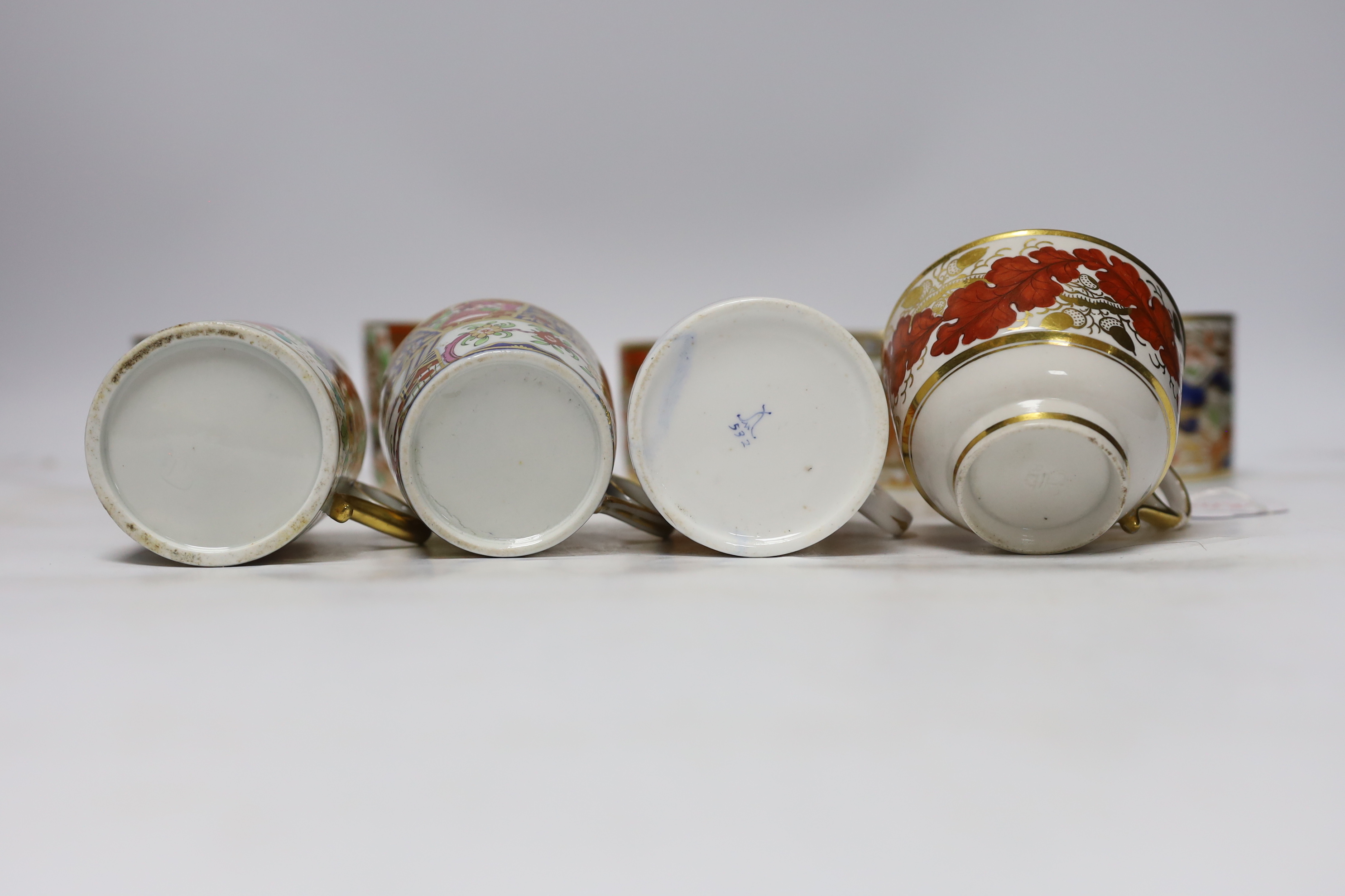 Twelve 1800-1820 English porcelain coffee cans and tea cups, including Imari pattern examples